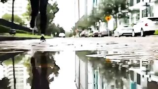 phone filming in puddle
