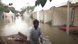 New Delhi family seeks relief from some of the worst floods to hit northern India in