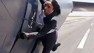 Hanging Outside an Aeroplan in the Sky