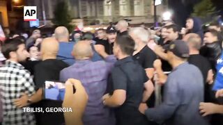 Supporters of ruling Georgian Dream party attack opposition rally in