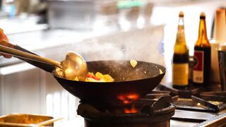 A Cook Using A Wok 2