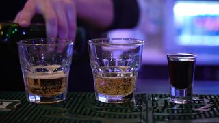 A Bartender Preparing Hard Drink On The Bar Counter