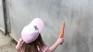 Little girl feeding her horses