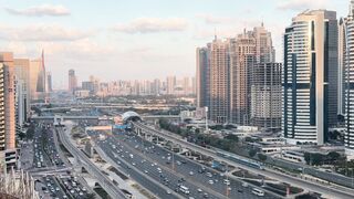 Bustling Cityscape with Skyscrapers at Dusk