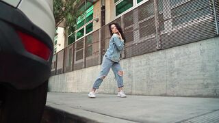 Woman Dancing on the Sidewalk