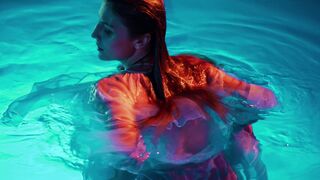 a girl swimming in a pool