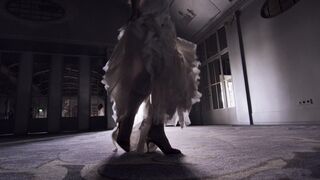 girl danicng in a dark room