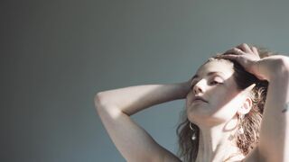 Woman Fixing Hair