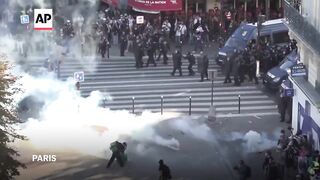 Police fire tear gas at protesters in Paris protesting against