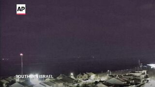 Large explosions turn the night sky over the Gaza Strip