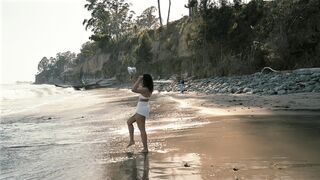 Woman at Seaside Enjoying the Waves