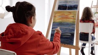Shot of a Girl Painting on Canvas
