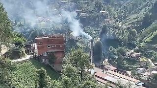 Secret Mountain Village Surrounded by Green Hills
