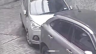 a young man made obscene gestures towards a burqa-clad woman in the middle of the road