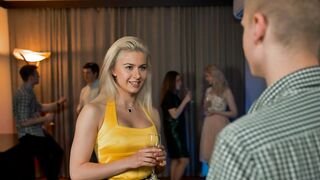 Woman flirting with a man at a party