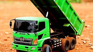 Hino Dump Truck Unloading on Red Soil