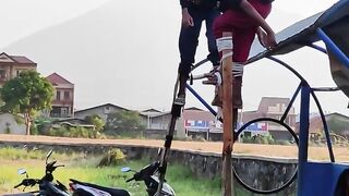 long legs playing in the middle of a beautiful village