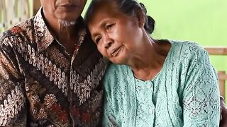 A touching moment of an old couple sitting quietly
