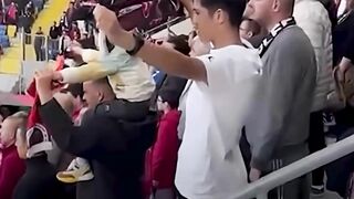 Turkish football fans throw toys onto field for Palestinian children