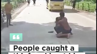 People caught a thief and beat him until he passed out