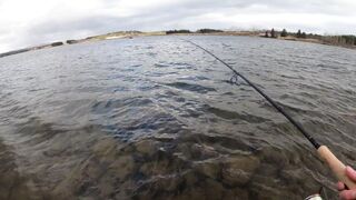 A person is casting a fishing rod and then spinning the fishing rod.