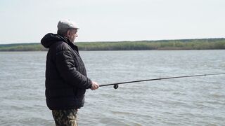 An old man is fishing