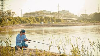Father and son are fishing