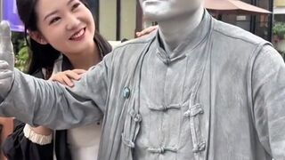 The silver man in China went viral after being approached by a beautiful woman