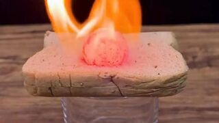 What Happens When a 1000 Metal Ball Hits Bread, Tissues, Tape  a Mask