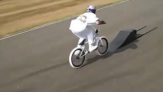 Insane Stunt! BMX Rider Jumps Over Formula 1 Car on Race Track