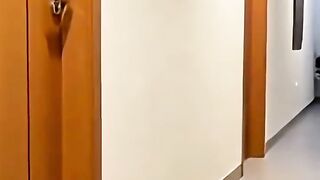 Naughty cat playing with hotel room bell