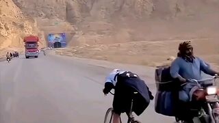 Riding a Bike Against the Current But Winning! His Skills Are Unbelievable