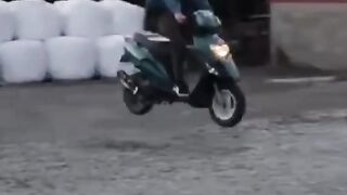 a person on a scooter attempting a stunt.