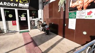 A cute cat on a motorcycle came up to us meowing when she saw us.