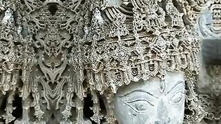 of a Strange Carving on the Head of a Statue in India