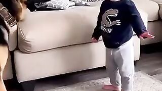A baby who is very familiar with pets