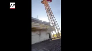 Fire teams rescue teen dangling for hours from 36-story crane in