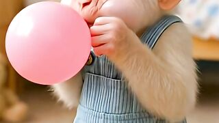 Monkey Child Blowing Balloon