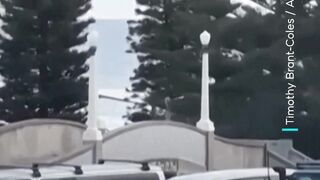 Footage captures two gunmen firing shots at Sydney beach