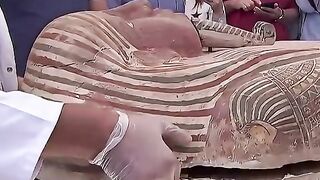 Opening the coffin of an ancient mummy.mp4