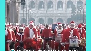 People in Santa Claus costumes cycle through Rome to support sick children