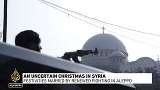 Syrians celebrate Christmas amid uncertainty after renewed fighting in Aleppo.mp4
