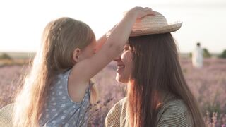 happy young mother and little girl