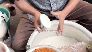 Bangladeshi uncle selling traditional steamed rice cakes
