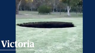 Giant sinkhole opens in sporting oval in Melbournes north-east