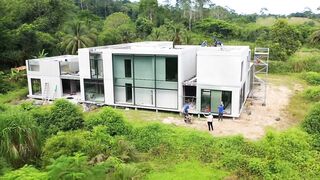 Modernbhouse walls installed large glass windows being added workers installi