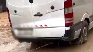 Vehicle trapped in floods