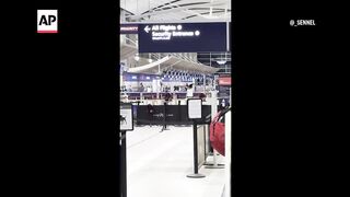 Car crashes into Detroit-area airport entrance, injuring 6.