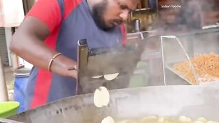 Making cassava chips in India