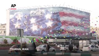 Iran unveils mural warning of retaliation if US conducts a military strike.